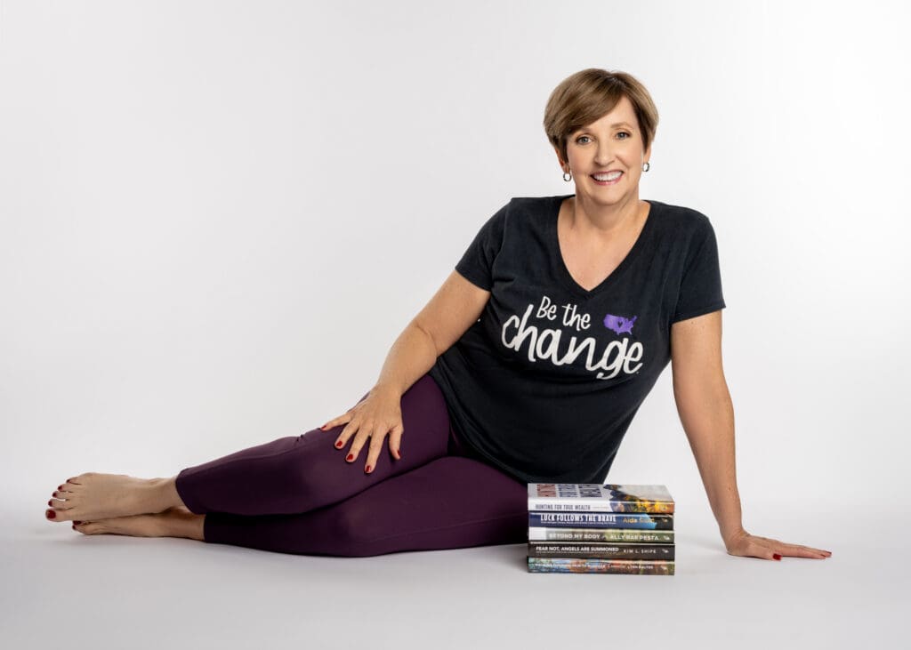 Laura Bush Sitting on Ground with Books